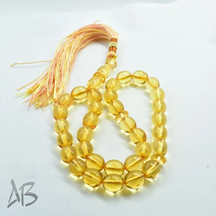 تسبیح سندلوس 33 دانه اصل بودار کد 1156 تراش تخم‌مرغی زرد شفاف آقابزرگ - Image 3