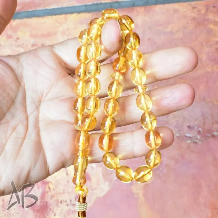 تسبیح سندلوس 33 دانه اصل بودار کد 1156 تراش تخم‌مرغی زرد شفاف آقابزرگ - Image 6