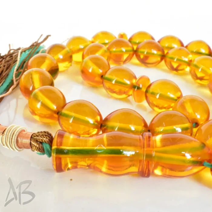 تسبیح سندلوس 33 دانه اصل بودار کد 1248 عسلی سایز 14 در 17 تراش تخم‌مرغی - Image 5