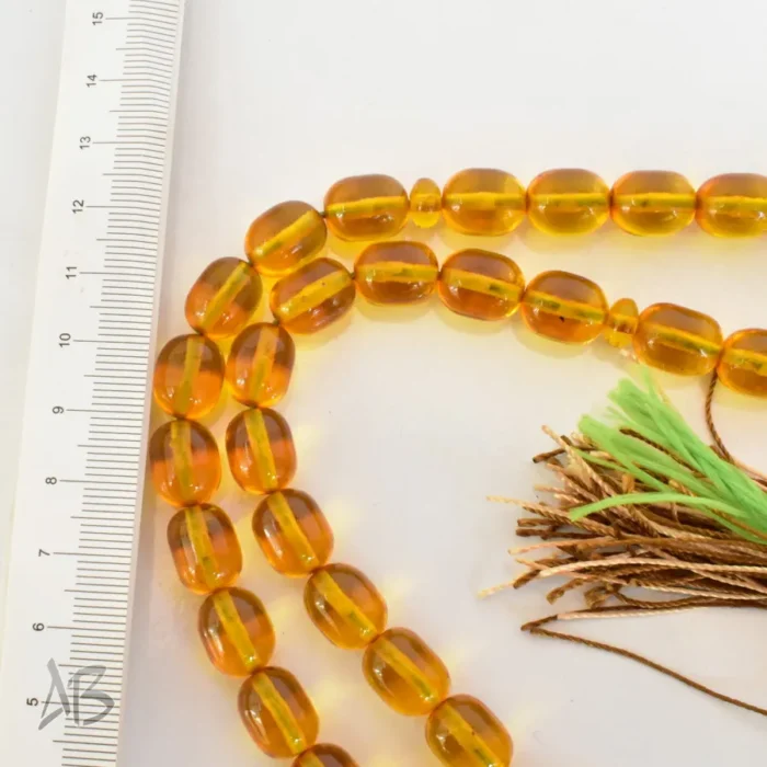 تسبیح سندلوس 33 دانه اصل کد 1276 بودار تراش بیضی زرد رنگ کوتاه و زیبا سایز 10 در 12 - Image 4