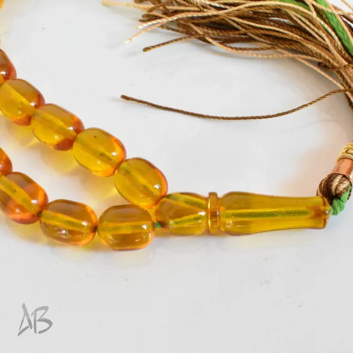 تسبیح سندلوس 33 دانه اصل کد 1276 بودار تراش بیضی زرد رنگ کوتاه و زیبا سایز 10 در 12 - Image 6